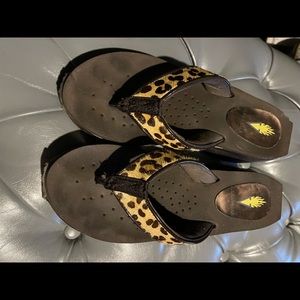 Volitale animal print flip with platform sole.